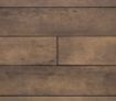 Close-up view of Millboard Enhanced Grain composite decking boards in a warm brown finish, showcasing realistic wood grain texture and natural variation for a timber-like appearance