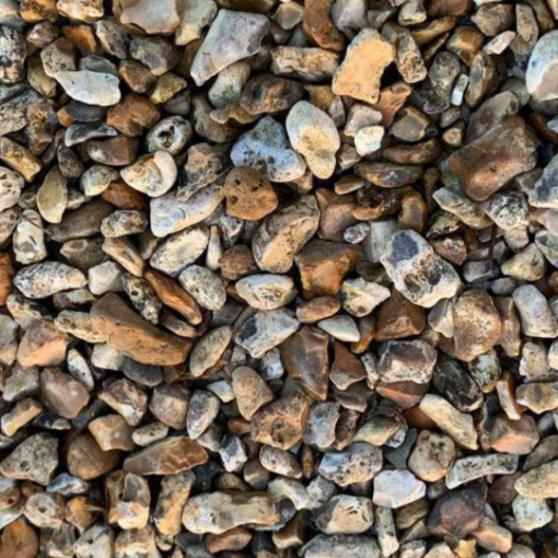 Close-up of 20mm Dorset flint gravel showcasing natural golden and amber tones