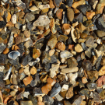 Close-up of 20mm Newbury Style flint gravel showcasing natural buff, grey, and amber tones