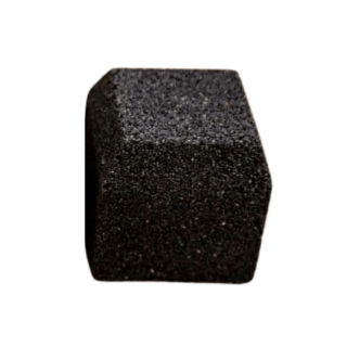 Close-up image of a single black block paving brick with a textured finish, shown against a white background to highlight its shape and surface detail